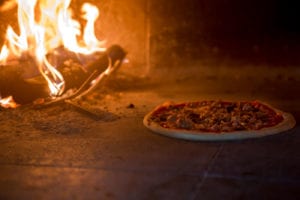 Hot fire oven with pizza baking
